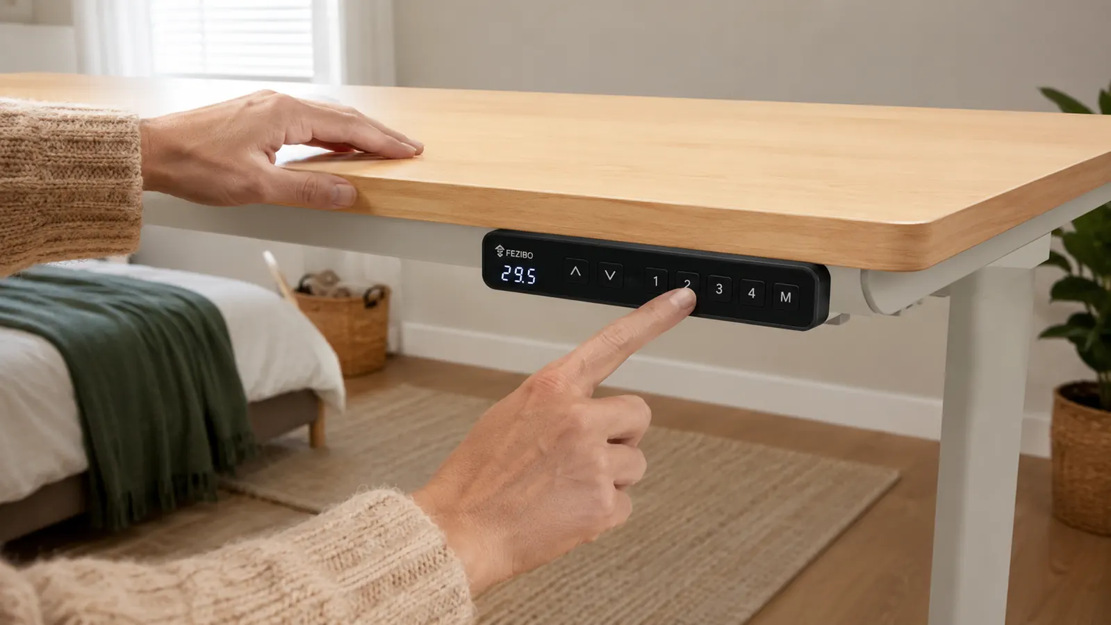 Hand pressing the memory preset button on the FEZIBO standing desk control panel